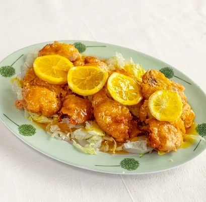 Sliced golden lemon chicken with bright lemon sauce at Szechuan Kitchen, Broadway Avenue Saskatoon